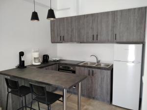 Kuchyň nebo kuchyňský kout v ubytování Armonia - Brand new apartment in Ermioni Village