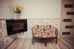 a living room with a fire place next to a fireplace at Molex Apartments 2 in Chernihiv