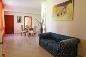 a living room with a couch and a table at Marilena in Matala