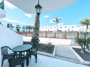 A balcony or terrace at Blue Island Pool View & Wi-Fi by iRent Fuerteventura
