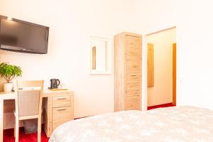 Postel nebo postele na pokoji v ubytování Hotel Klimt