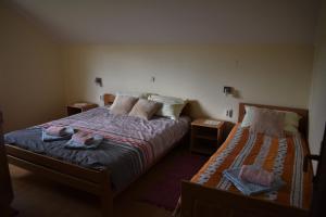 Postel nebo postele na pokoji v ubytování Apartments Sabljak