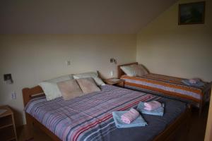 Postel nebo postele na pokoji v ubytování Apartments Sabljak