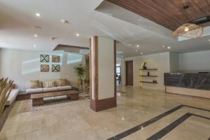 a living room with a couch and a fireplace at The Bay Hotel Hurghada Marina in Hurghada