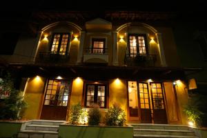 a house at night with lights at THE SUNSET BAY in Fort Kochi