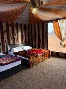 Vuode tai vuoteita majoituspaikassa Wadi Rum Star Camp