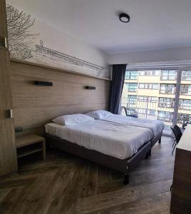 Letto o letti in una camera di Hotel Sandeshoved Zeedijk