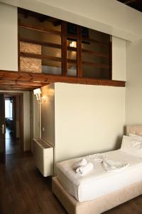 Postel nebo postele na pokoji v ubytování Hotel Onufri