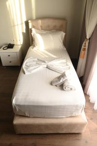 Postel nebo postele na pokoji v ubytování Hotel Onufri