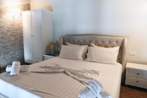 Postel nebo postele na pokoji v ubytování Hotel Onufri