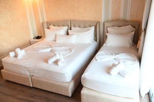Postel nebo postele na pokoji v ubytování Hotel Onufri
