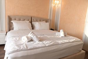 Postel nebo postele na pokoji v ubytování Hotel Onufri