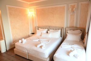 Postel nebo postele na pokoji v ubytování Hotel Onufri