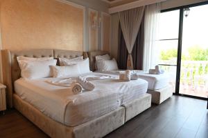 Postel nebo postele na pokoji v ubytování Hotel Onufri