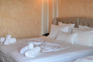 Postel nebo postele na pokoji v ubytování Hotel Onufri