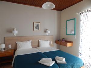 Postel nebo postele na pokoji v ubytování Posidonio Hotel
