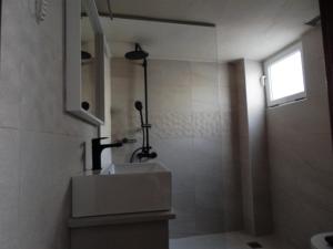 Koupelna v ubytování Posidonio Hotel