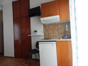 Kuchyň nebo kuchyňský kout v ubytování Posidonio Hotel