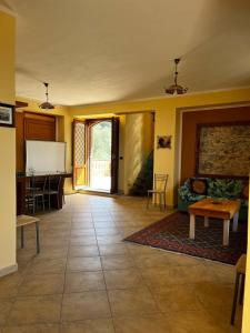 a living room with a couch and a table at Casa Maria Host Green - Casa vacanze - Rossano in Case San Francesco