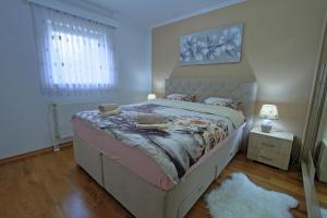 Posteľ alebo postele v izbe v ubytovaní Holiday House Lana