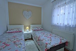 Posteľ alebo postele v izbe v ubytovaní Holiday House Lana