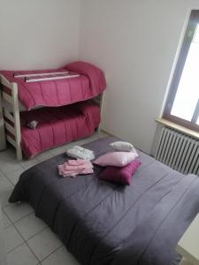 Posteľ alebo postele v izbe v ubytovaní B&B Nonna BI