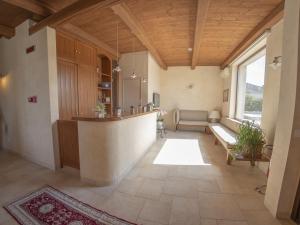 a large living room with a kitchen and a couch at Masseria Chinunno in Altamura