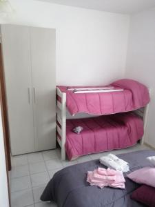 Posteľ alebo postele v izbe v ubytovaní B&B Nonna BI