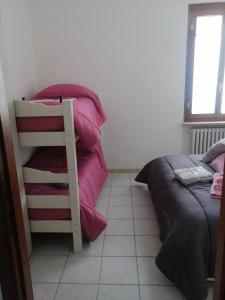 Posteľ alebo postele v izbe v ubytovaní B&B Nonna BI