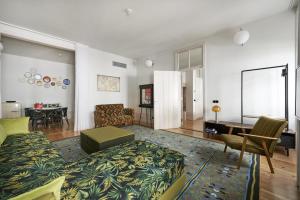 a living room with a couch and a table at Cais Urban Lodge in Lisbon