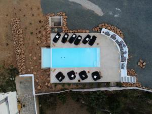 an overhead view of a building with a swimming pool at Aloe Mare Suites in Liaropá
