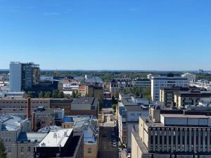 an aerial view of a city with buildings at Upea 12 kerroksen kaksio ydinkeskustassa in Oulu