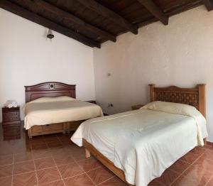 Postel nebo postele na pokoji v ubytování Hotel La Condesa + 19 fotografií