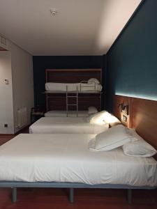 Postel nebo postele na pokoji v ubytování ARVA Spa París