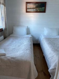 Giường trong phòng chung tại Stor stugan