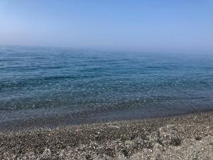 a rocky beach with the ocean in the background at Residence Mareblu in Nocera Terinese