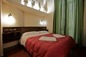 Postel nebo postele na pokoji v ubytování Hotel Panda + 22 fotografií