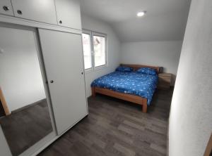 Postel nebo postele na pokoji v ubytování Apartman Amina-Ahmad Vinac-Jajce