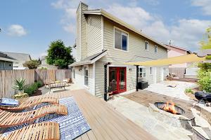 a backyard with a fire pit and a house at Victorian Dream in Arroyo Grande
