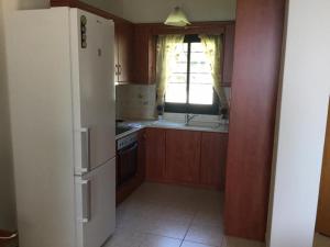 A kitchen or kitchenette at Villa Kalandra