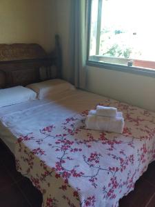 Tempat tidur dalam kamar di Pousada Mangaba da Serra