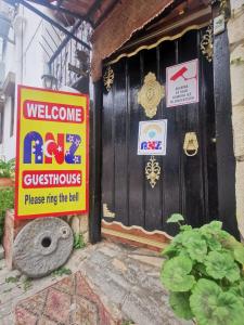 a door to a guest house with signs on it at Anz Guest House Pansiyon in Selcuk