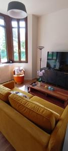 a living room with a couch and a table at Castel de Satoya in Belfort