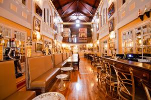 a bar with a row of tables and chairs at Amsterdam Castle NY in Amsterdam