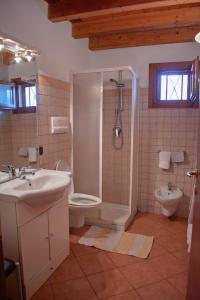 a bathroom with a sink and a toilet and a shower at CosmoCom Apartment Porto Antigo 1 Santa Maria Sal Island in Santa Maria