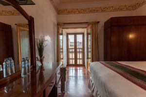 Postel nebo postele na pokoji v ubytování Hotel Rojas Inn