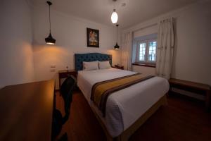Postel nebo postele na pokoji v ubytování Hotel Rojas Inn