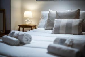 Una cama o camas en una habitación de Appartamento incantevole nel cuore di Roma, Monti