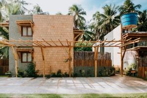 a house under construction with a water tank at Vila do Porto, Praia do Patacho - Bangalô Patacho in Pôrto de Pedras