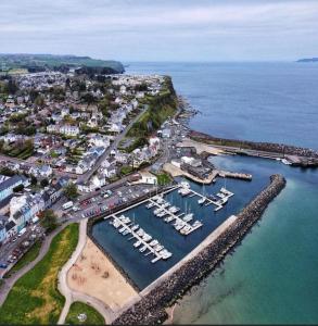 an aerial view of a harbor with boats in the water at Church View B&B in Ballycastle